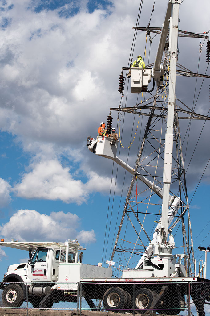 NEAT apprentices work on transmission tower