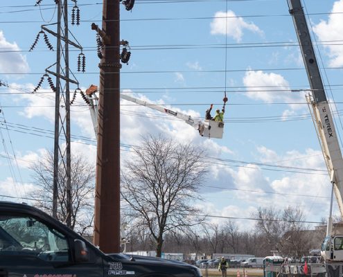 Outside lineman working on H-frame transmission systems